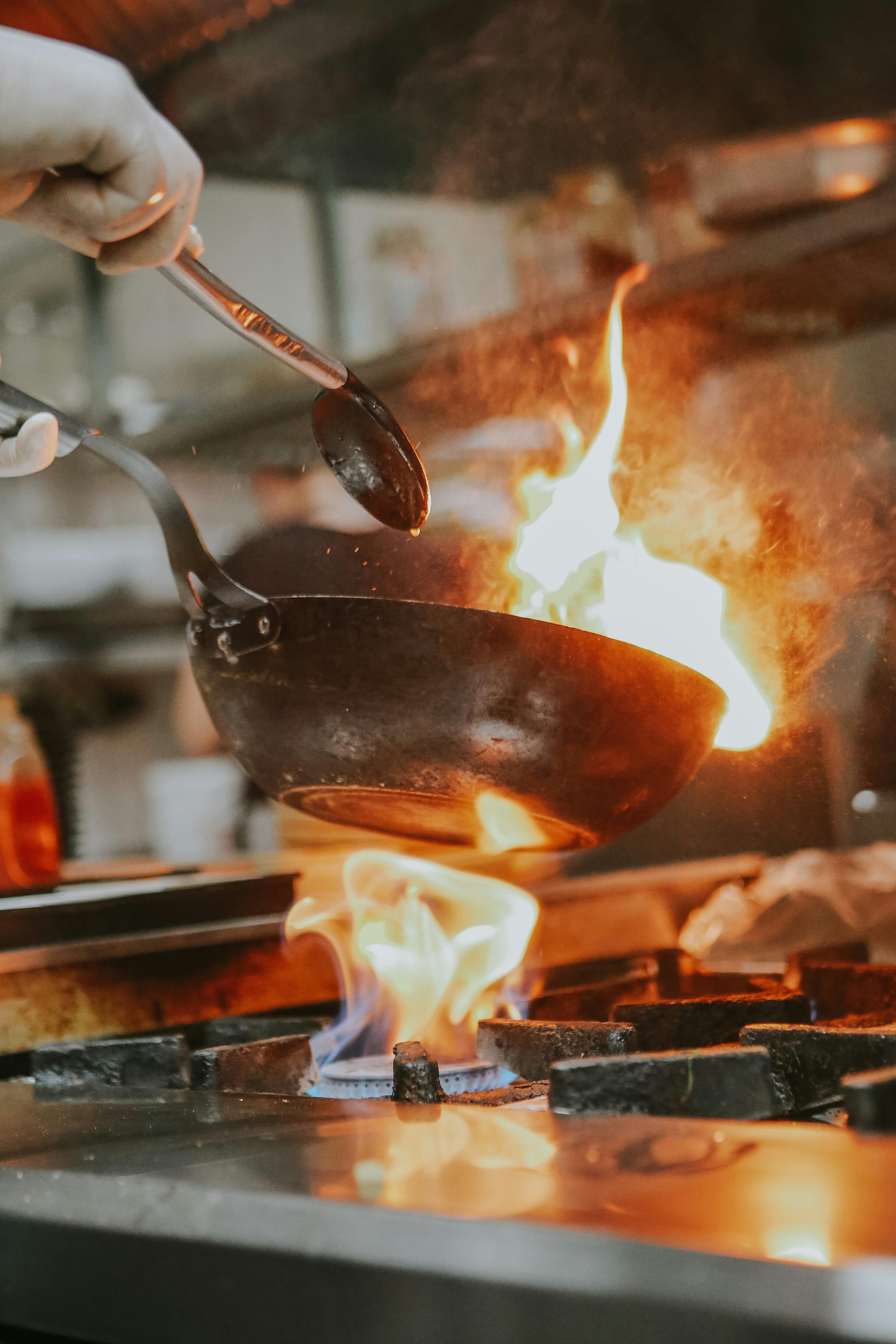Chef plating food in a restaurant kitchen